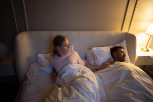 Partner sleeping peacefully next to someone with sleep apnea using CPAP therapy