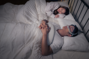 Person sleeping comfortably with CPAP mask after overcoming CPAP intolerance