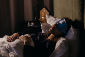 Adult relaxing with a book while wearing a CPAP mask as part of a calm bedtime routine